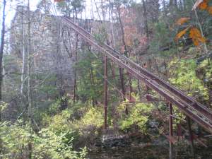 A giant conveyor went deep into the quarry to bring up lime from the earthThe conveyor ended somewhere in the bottomless quarry, now filled with dark water