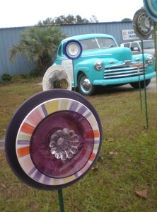 Cute lawn ornament made from odd plates/dishes. The lawn ornament in the back row with 4 wheels is nice too.